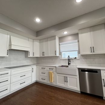 TJ Home Services - a kitchen with white cabinets and stainless steel appliances - General Contractors Near Me TJ Home Services - a kitchen with white cabinets and stainless steel appliances - General Contractors Near Me