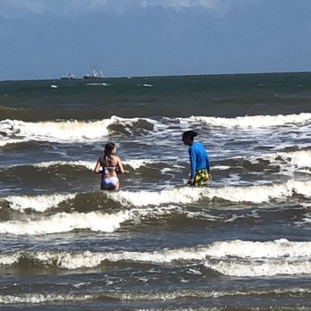 Ohana Surf & Skate - Anthony showing my daughter how to surf! - Surfing Near Me - Galveston, Texas