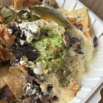 Senor's Chili - A giant messy nacho   cold items weren't packaged separately and nobody wants warm guacamole - Breakfast & Brunch Near Me - Chester, Maryland