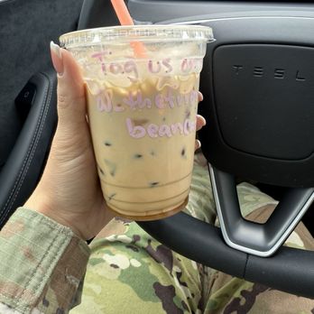 The Friendly Bean - Iced white chocolate americano with cream - white chocolate powder caked at bottom of cup - Coffee & Tea Near Me - Lakewood, Washington The Friendly Bean - Iced white chocolate americano with cream - white chocolate powder caked at bottom of cup - Coffee & Tea Near Me - Lakewood, Washington