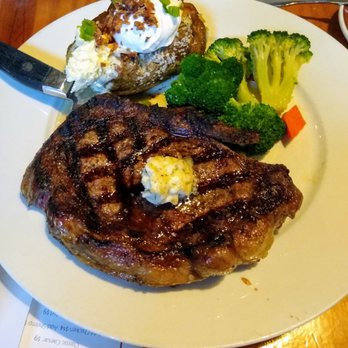Flying Saddle Resort - Massive rib eye steak with peppercorn butter, loaded baked potato, mixed veggies. - Hotels Near Me - Alpine, Wyoming Flying Saddle Resort - Massive rib eye steak with peppercorn butter, loaded baked potato, mixed veggies. - Hotels Near Me - Alpine, Wyoming