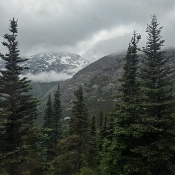 Celebrity Cruises - View of Alaska mountains from a train excursion. - Boat Tours Near Me - Seattle, Washington Celebrity Cruises - View of Alaska mountains from a train excursion. - Boat Tours Near Me - Seattle, Washington