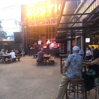 The Rustic - Back outside Patio & live music stage - New American Near Me - Dallas, Texas