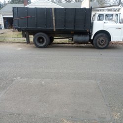 Johnson Junk Removal - Passenger side view: length and height of service vehicle.