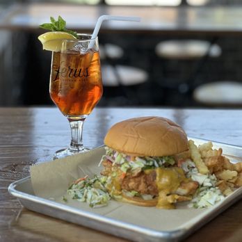 Ferus on 41st - Featured Sandwich - Curry fried chicken with citrus slaw - Breweries Near Me - Birmingham, Alabama Ferus on 41st - Featured Sandwich - Curry fried chicken with citrus slaw - Breweries Near Me - Birmingham, Alabama