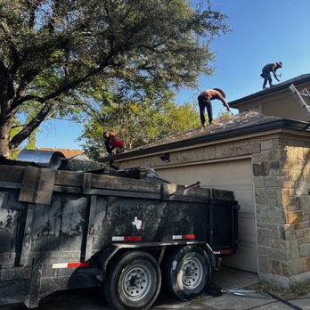 Aguirre's Construction - two men working on a roof - Roofing Near Me