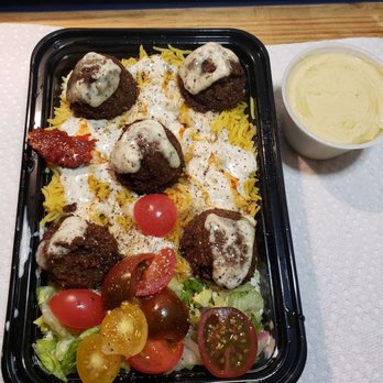 NYC Falafel - Tomatoes, tahini and harissa added my me.. - Halal Near Me - New York, New York