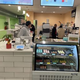 Counter with many different flavors of macarons. Counter with many different flavors of macarons.