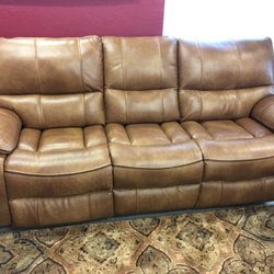 Griffin's Furniture Outlet - LEATHER Power Reclining sofa with head tilt adjustment. Great Value!