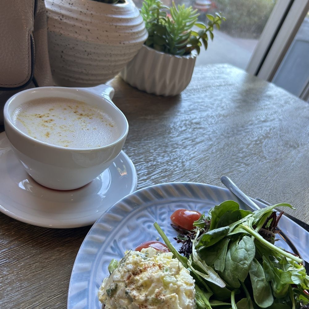 Lola's Cafe - Hot Turmeric Chai Latte and open faced egg salad sandwich on olive bread - Coffee & Tea Near Me - Ladera Ranch, California