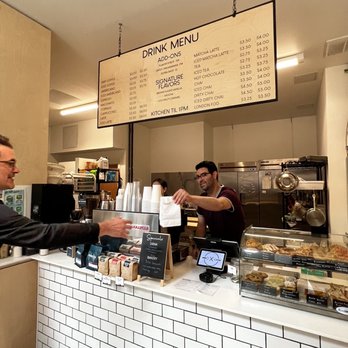 Little City Coffee & Kitchen - a man serving a customer - Coffee & Tea Near Me - Providence, Rhode Island Little City Coffee & Kitchen - a man serving a customer - Coffee & Tea Near Me - Providence, Rhode Island