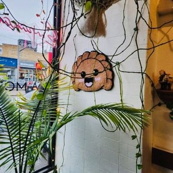 La Morena - Cute empanada wall decor - Cafes Near Me - Toronto, Ontario