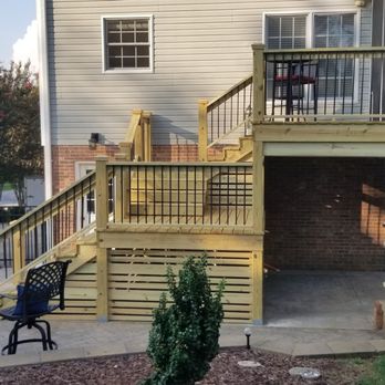 Scott Stanley Construction - a view of a deck and patio - Decks & Railing Near Me Scott Stanley Construction - a view of a deck and patio - Decks & Railing Near Me