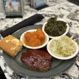 Meatloaf, cabbage, greens, cornbread, and yams