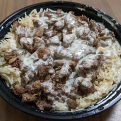 Plates & Bowls - Beef shawarma on rice with garlic sauce. BOGO on Uber Eats.