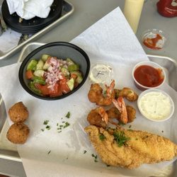 Rougeaux's - My niece and I split catfish and shrimp. Tomato cucumber salad was great and the hushpuppies were delicious.