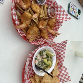 Coconut Jack’s - Coconut shrimp, fresh cut fries, ceviche with fresh cut corn chips fried to perfection. - Bars Near Me - South Padre Island, Texas Coconut Jack’s - Coconut shrimp, fresh cut fries, ceviche with fresh cut corn chips fried to perfection. - Bars Near Me - South Padre Island, Texas