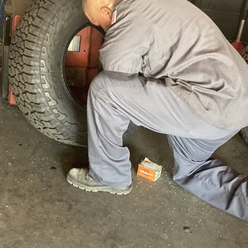 San Dimas Tire Pros - Corona Mechanic cleaning up the mess of the busted sandbag done by Tire Pros - Tires Near Me - San Dimas, California San Dimas Tire Pros - Corona Mechanic cleaning up the mess of the busted sandbag done by Tire Pros - Tires Near Me - San Dimas, California