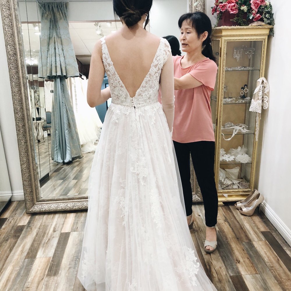 Tomato Wedding - Really liked the ethereal vibe of this dress! She said she could add sleeves with lace (she put on the sleeve on my right arm to show me). - Bridal Near Me - Buena Park, California Tomato Wedding - Really liked the ethereal vibe of this dress! She said she could add sleeves with lace (she put on the sleeve on my right arm to show me). - Bridal Near Me - Buena Park, California