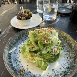 Pier At Harwich - Salad with mustard vinaigrette and fried onions. Garlic and oil fresh olives. Both were fantastic.