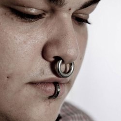 Body Pleasure Piercing - Septum piercing by Mus. Image credit: Body Pleasure Piercing.