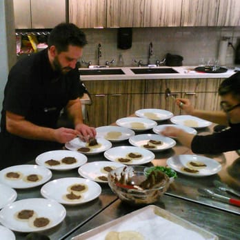 Get Cooking - Chef Toll and Chef Wu plating the Black Bean tostadas during vegan cooking class - Cooking Schools Near Me - Edmonton, Alberta