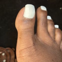 King J Nail Lounge And Spa II - I came in to get a chipped big toe nail fixed It is uneven, was not buffed correctly or acrylic added to it well. Horrible