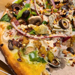 Perfectly cooked gluten-free crust piled high. Perfectly cooked gluten-free crust piled high.