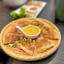 Roti with curry - some of the best roti I've ever had, by far Roti with curry - some of the best roti I've ever had, by far