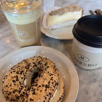Alchemist Coffee Project - Crème Brûlée Iced Coffee, Everything bagel with cream cheese, New York cheesecake with crushed almonds, Mexican Mocha Latte (hot) - Coffee & Tea Near Me - Los Angeles, California