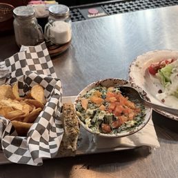 Spinach artichoke dip with fresh kettle chips and I wedge ceaser salad. Spinach artichoke dip with fresh kettle chips and I wedge ceaser salad.