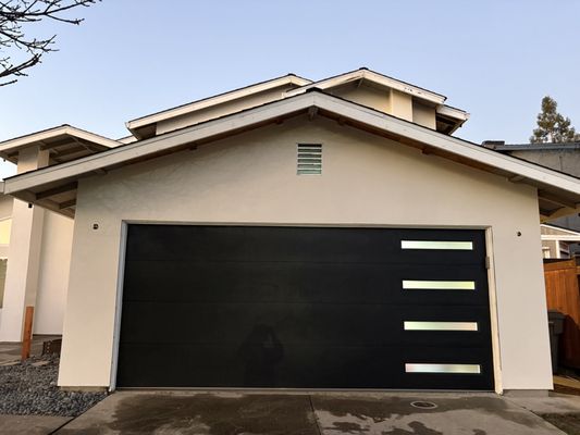 Skylite C.H.I garage door installtion - C.H.I. Skylite garage door installation (steel-back) with window panels, paired with a LiftMaster belt-drive opener for smooth, quiet operation. Clean finish, properly balanced, and tested for safe performance.