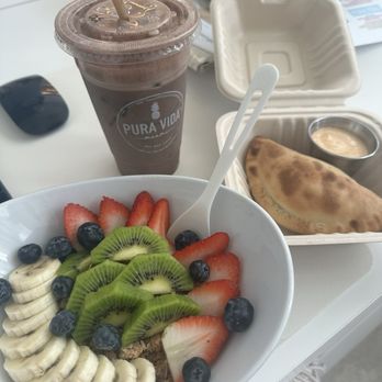 Pura Vida Miami - FRUIT SALAD SPINACH AND CHEESE EMPANADA ICED BANANA BREW - Breakfast & Brunch Near Me - Miami Beach, Florida Pura Vida Miami - FRUIT SALAD SPINACH AND CHEESE EMPANADA ICED BANANA BREW - Breakfast & Brunch Near Me - Miami Beach, Florida