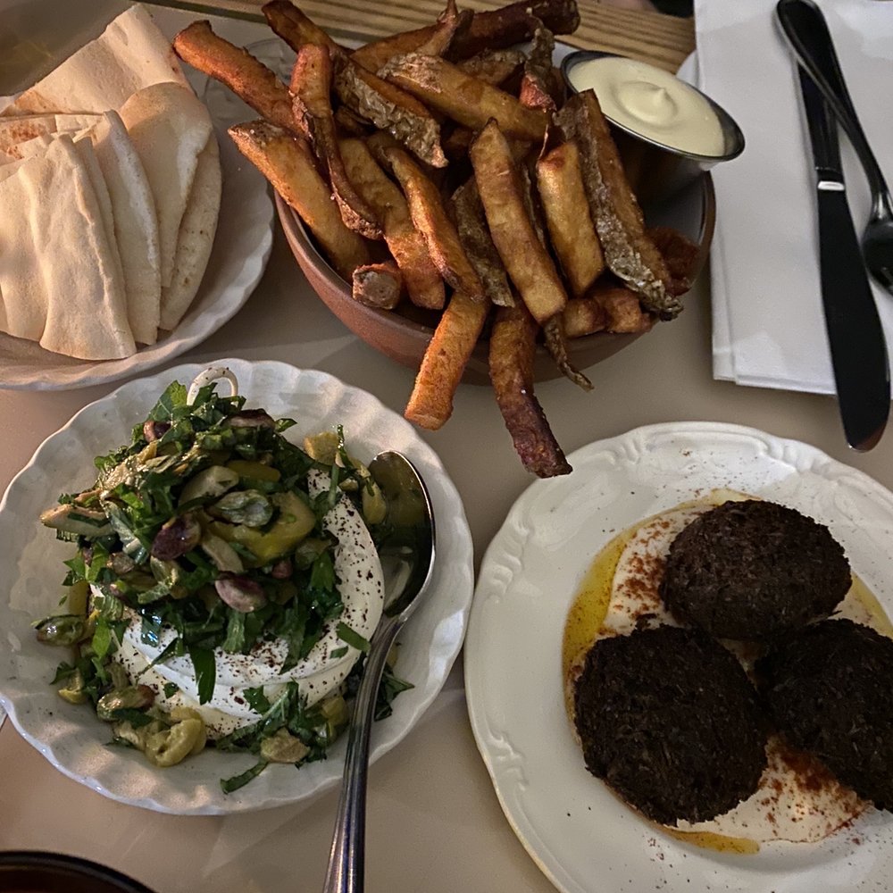 Bar St-Denis - a table of food and drinks - Bars Near Me - Montreal, Quebec