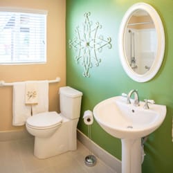 Forever Young Memory Care - The green wall provides a contrast with the white toilet and sink to help our visually impaired residents.