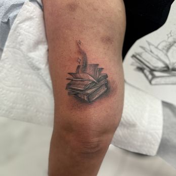 Imaginarium Ink Gallery - Felipe did the realistic books - Tattoo Near Me - Delray Beach, Florida Imaginarium Ink Gallery - Felipe did the realistic books - Tattoo Near Me - Delray Beach, Florida
