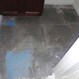 An example of taking the easy way out and not removing baseboards prior to tiling An example of taking the easy way out and not removing baseboards prior to tiling