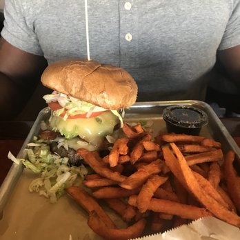 Nicky Rottens - Bacova burger with sweet potato fries, and a side of syrup for dipping. - Sports Bars Near Me - Coronado, California Nicky Rottens - Bacova burger with sweet potato fries, and a side of syrup for dipping. - Sports Bars Near Me - Coronado, California