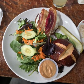 Railroad Station Bar and Grill - Bacon cheeseburger on pretzel bun and side salad - New American Near Me - Cloverdale, California Railroad Station Bar and Grill - Bacon cheeseburger on pretzel bun and side salad - New American Near Me - Cloverdale, California