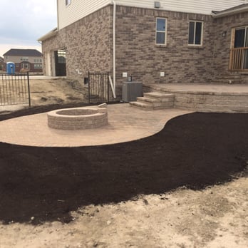 Todaro's Landscaping - a patio with a fire pit - General Contractors Near Me - Chesterfield, Michigan Todaro's Landscaping - a patio with a fire pit - General Contractors Near Me - Chesterfield, Michigan