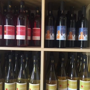 Sugarbush Vineyards - a shelf full of wine bottles - Wine Tasting Room Near Me - Hillier, Ontario Sugarbush Vineyards - a shelf full of wine bottles - Wine Tasting Room Near Me - Hillier, Ontario