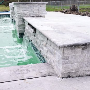 Rio Mar Pools - Rio Mar Pools show Water Shears can add soothing & relaxing sound; the Raised Wall also enhances the space with privacy and bench seating. - General Contractors Near Me - Houston, Texas