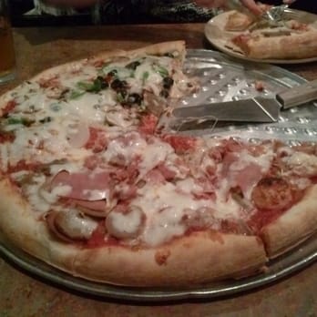 Moon River Pizza - A large half special half t-rex pizza - Pizza Near Me - Jacksonville, Florida Moon River Pizza - A large half special half t-rex pizza - Pizza Near Me - Jacksonville, Florida