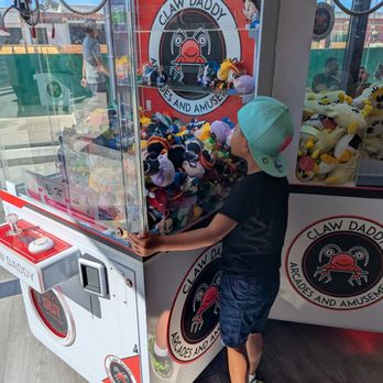 Claw Daddy Arcade - Carefully calculating his next move - Arcades Near Me - San Diego, California