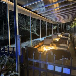 Ernie’s on the Creek - Outdoor patio with fire pits, creekside