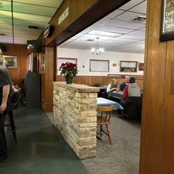Sunny's Sunset Supper Club - Between the bar and the restaurant. I loved all the original wood paneling and this stone divider.