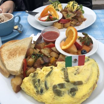 Immigrant Son Caffe - Omelette/potatoes/fruits and eggs Benedict with potatoes/fruits on the side. - New American Near Me - Ventura, California Immigrant Son Caffe - Omelette/potatoes/fruits and eggs Benedict with potatoes/fruits on the side. - New American Near Me - Ventura, California
