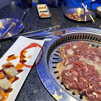 Firepan Korean BBQ - You can see some of the juice from the raw bulgogi on the plate. - Korean Near Me - Silver Spring, Maryland Firepan Korean BBQ - You can see some of the juice from the raw bulgogi on the plate. - Korean Near Me - Silver Spring, Maryland