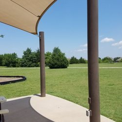 Looking north from playground area at surrounding paved path