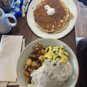 First Watch - Biscuits and Turkey Sausage Gravy with Eggs - 2 Chocolate chip Pancakes - Breakfast & Brunch Near Me - Hickory, North Carolina